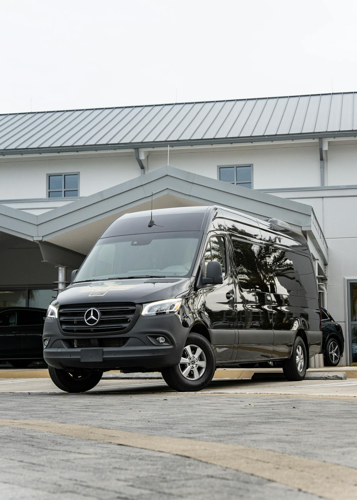 Brand new black Mercedes-Benz Sprinter van